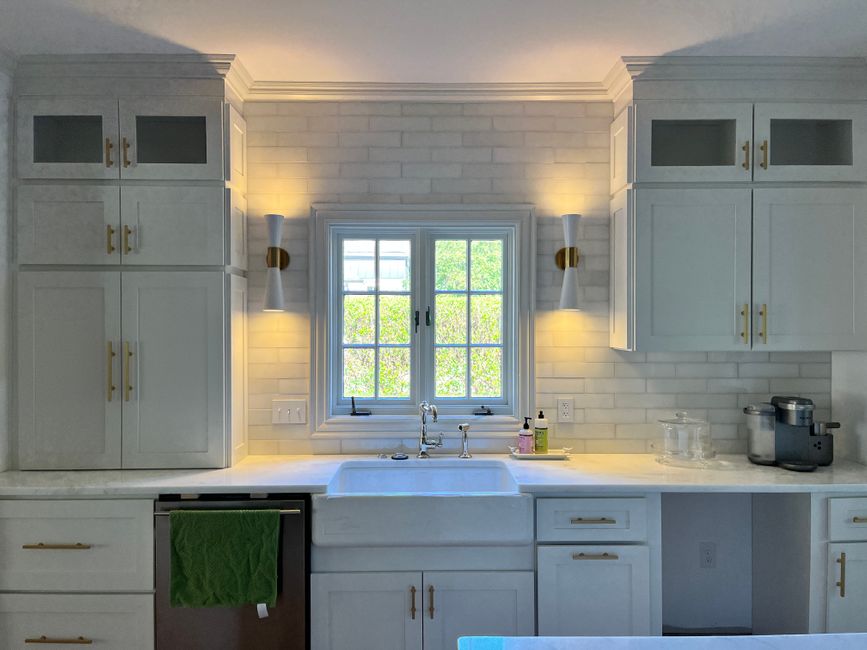 Light-filled room with a polished stone surface and large windows